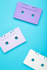 Old colorful cassettes on a blue background. Music day
