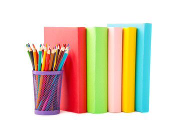 Fototapeta premium Multi coloured school books and pencils isolated on white background