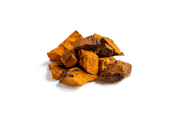 chaga mushroom. a pile of large pieces natural wild birch fungus chaga isolated on white background