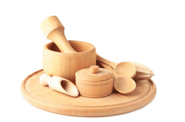 Collection of wooden kitchen utensils isolated on white background.