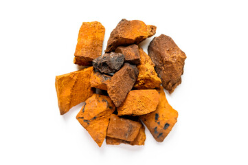 chaga mushroom. a pile of large pieces natural wild birch fungus chaga isolated on white background. top view
