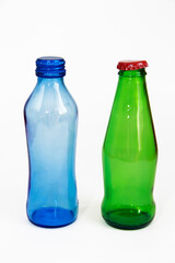 blue and green glass liquid bottles