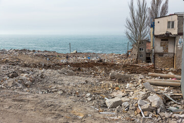 Landslide caused by rains of hurricane destroyed expensive cottages and houses. Destroyed house,...