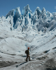 The Perito Moreno Glacier is a glacier located in the Los Glaciares National Park in Santa Cruz Province, Argentina. Traveler climber on glacier background Perito Moreno.