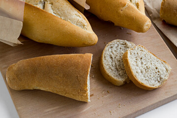 Traditional Turkish Standart Breads in the craft paper bag.White surface,above view.