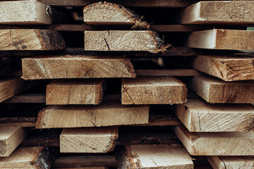Piles of wooden boards in the sawmill, planking. 