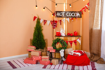 Christmas decorated room. Vintage New Year decorations. Gift boxes under fir-tree. Christmas mood. Celebrating of New Year