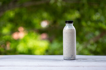 bottle of  soy milk on the grass