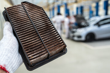 Car air filter in the cabin of the car is dirty and damaged by the use of car air filter