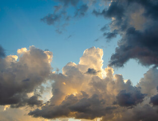 Storm clouds lit by the morning sun.