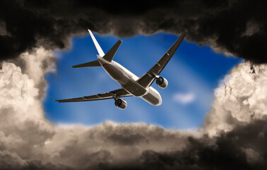 Airplane breaks through dark clouds