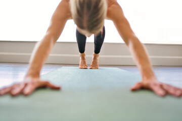 Fototapeta na wymiar Nice yoga teacher woman in a studio indoors