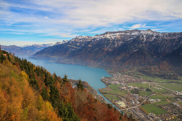 View of Lake Thun (Thunersee) near Interlaken with Swiss Alps and forest in autumn (view point Harder Kulm)