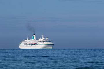 Fototapeta na wymiar Cruise ship running in harbour