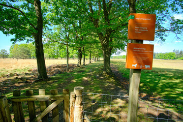 Borger, the Netherlands, May 19 2020, Entrance gate to nature reserve, grazing area, dutch sign, keep distance, be aware