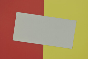 White paper template on colorful background. Top view and copy space.