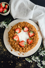 Honey layered cake decorated with strawberries.