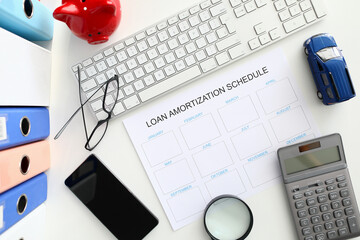 White calendar with loan amortization shedule sign closeup background. Right bank credit concept