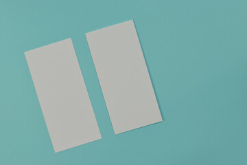 Bifold white template paper on blue texture. copy space.