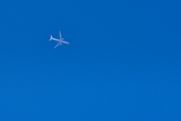 a passenger plane in the blue sky