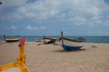 Fototapeta na wymiar Boats on the beach. Walking on the sea. Rest.