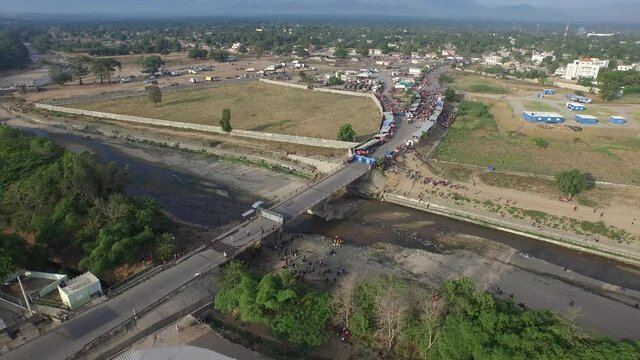 Aerial backward at Dajabon bridge over river, Dominican Republic