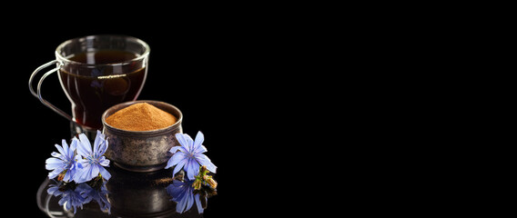 Diet drink chicory in a cup - coffee substitutes, powder and fowers on the dark background. Banner. Long image