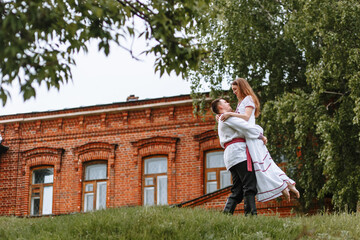 A couple in love in Russian traditional dresses