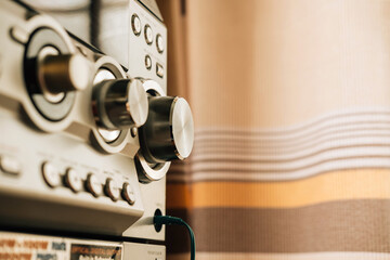 Close up photo of the control panel with buttons and level controls of modern compact hi-fi system...