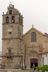 Fototapeta na wymiar Vasco da Gama Square, Vila do Conde’s Matrice Church (Mother Church, Igreja Matriz), dedicated to St. John the Baptist in Vila do Conde, Portugal.