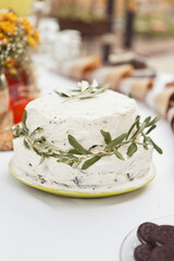 Obraz na płótnie Canvas Cake for Wedding or Birthday party. White rustic cake with fresh olive branches