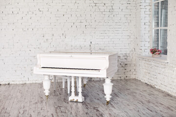 White piano in a white room