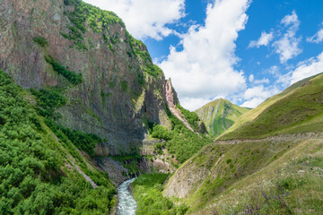  Truso Valley and Gorge trekking / hiking route landscape, in Kazbegi, Georgia. Truso valley is a scenic trekking route close to the border of North Ossetia.