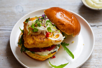Turmeric fish burger in brioche bun