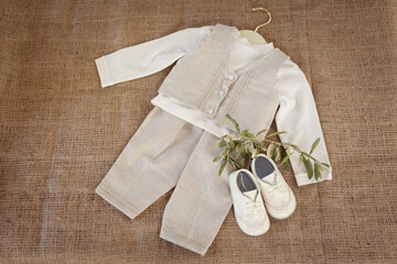 White cute booties and linen suit for little guy.
