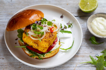 Turmeric fish burger in brioche bun