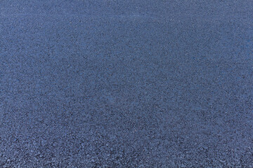 Fresh black asphalt on new street road. Construction at work.