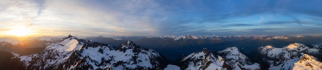 Aerial Panoramic View of Canadian Mountain Landscape, Tantalus Range, during a colorful sunset. Taken near Squamish, North of Vancouver, British Columbia, Canada. Nature Background Panorama