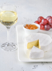 Camembert cheese with glass of wine