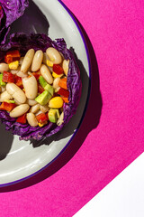 homemade bean salad with carrots, avocado, pepper