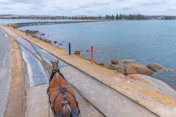 Horse drawn tram on a wooden causeway at Victor Harbor, Australia