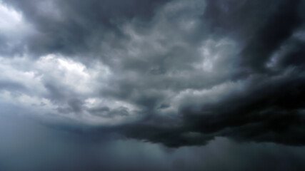 Black rain clouds are forming,A storm is about to occur.