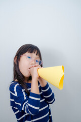 Emotional child. Cute upset little asian girl standing isolated over gray background. children kid screaming expression on isolated background