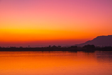 Fototapeta premium Nile river at sunset in Luxor, Egypt.