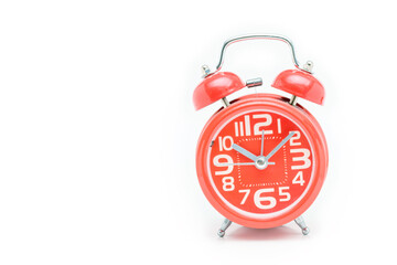 Red alarm clock on a white background