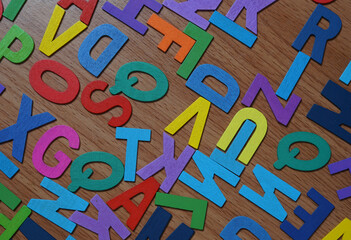 Colorful wooden alphabet on table