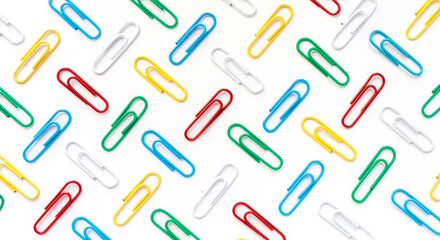 Bright colorful paper clips on a white background. Background, texture. Top view