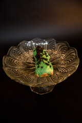 Fototapeta premium Delicious eclair in a crystal vase