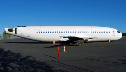 Economic crisis. Disassembled airplane at the airport parking.