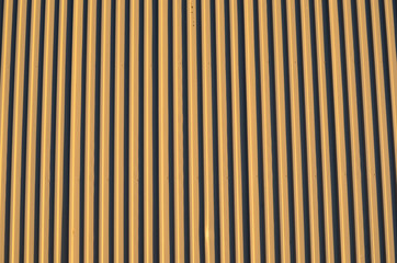 light brown corrigated steel plate building wall background